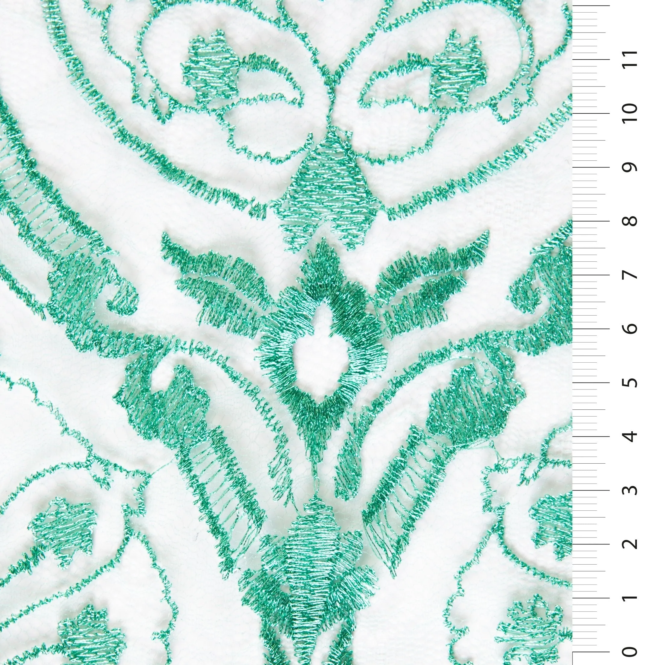 Symmetrical Embroidered Fabric with Decorative Embellishments