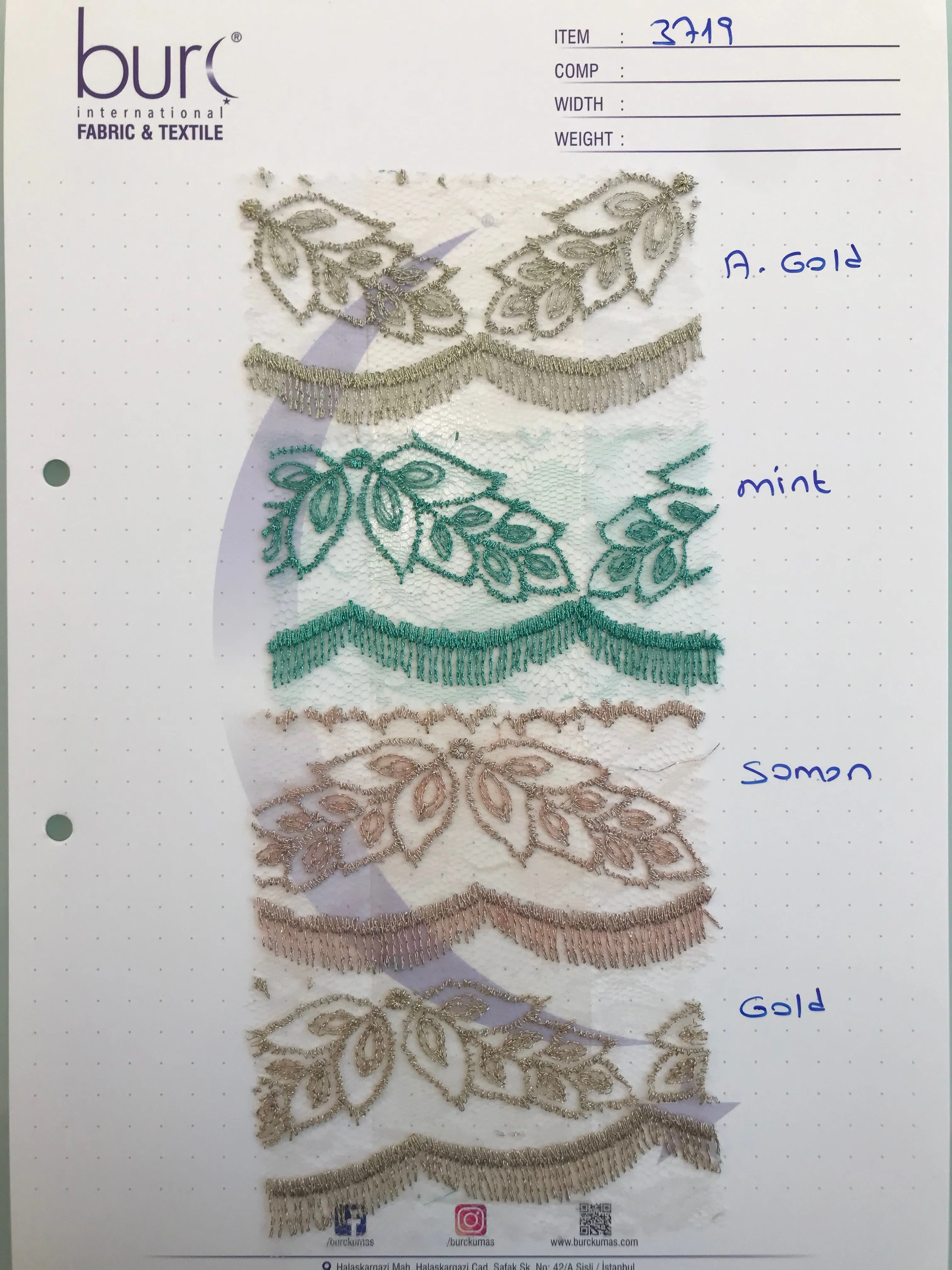 Symmetrical Embroidered Fabric with Decorative Embellishments