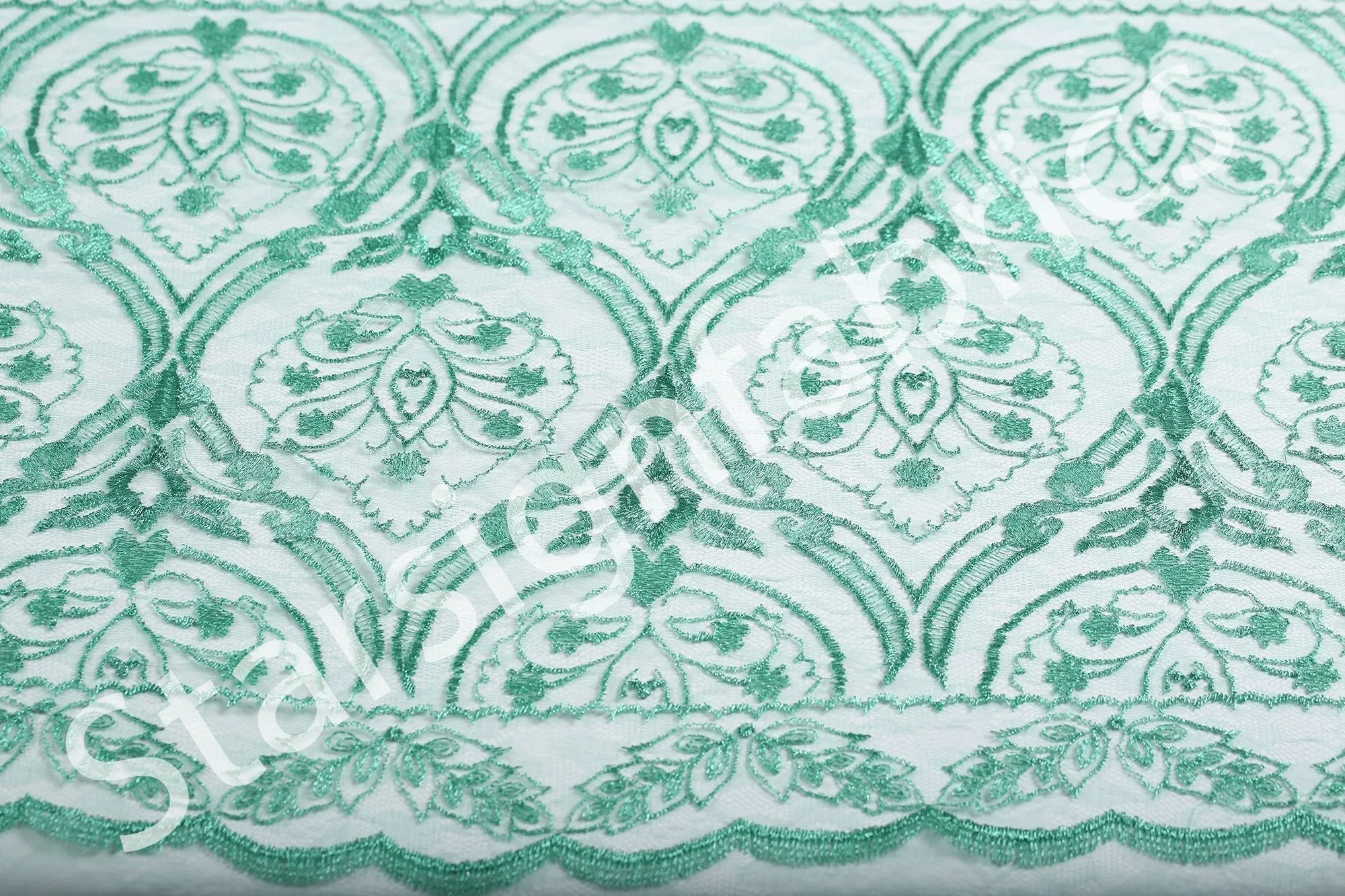 Symmetrical Embroidered Fabric with Decorative Embellishments